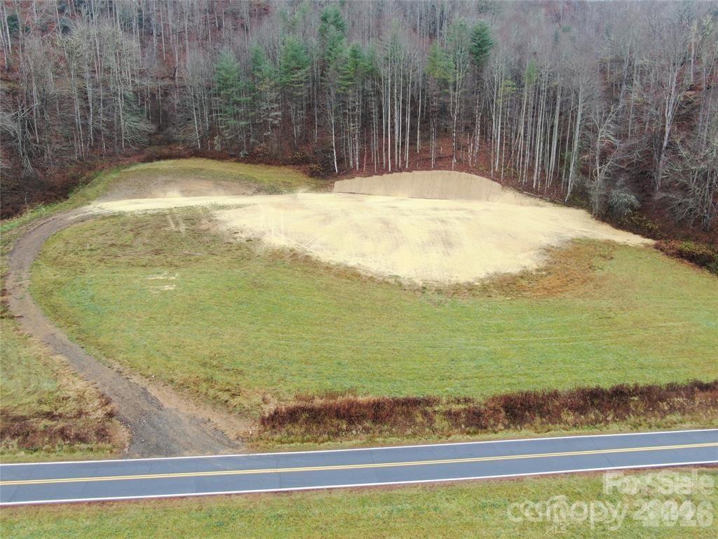 5570 Meadow Fork Road Hot Springs, NC 28743 - Photo 18 of 18 a view of a swimming pool with an outdoor space and seating area