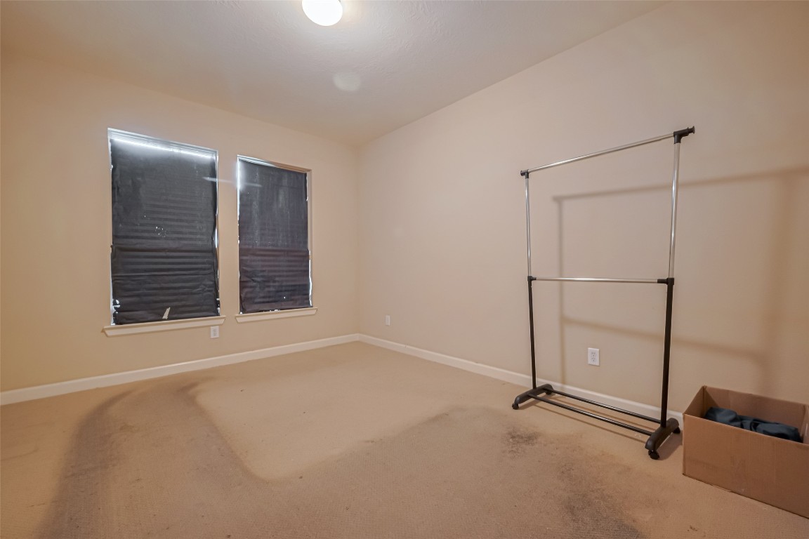 1703 Macclesby Lane Houston, TX 77049 - Photo 18 of 41 a view of an empty room with a window