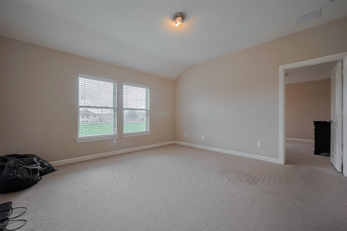 1703 Macclesby Lane Houston, TX 77049 - Photo 20 of 41 an empty room with a window
