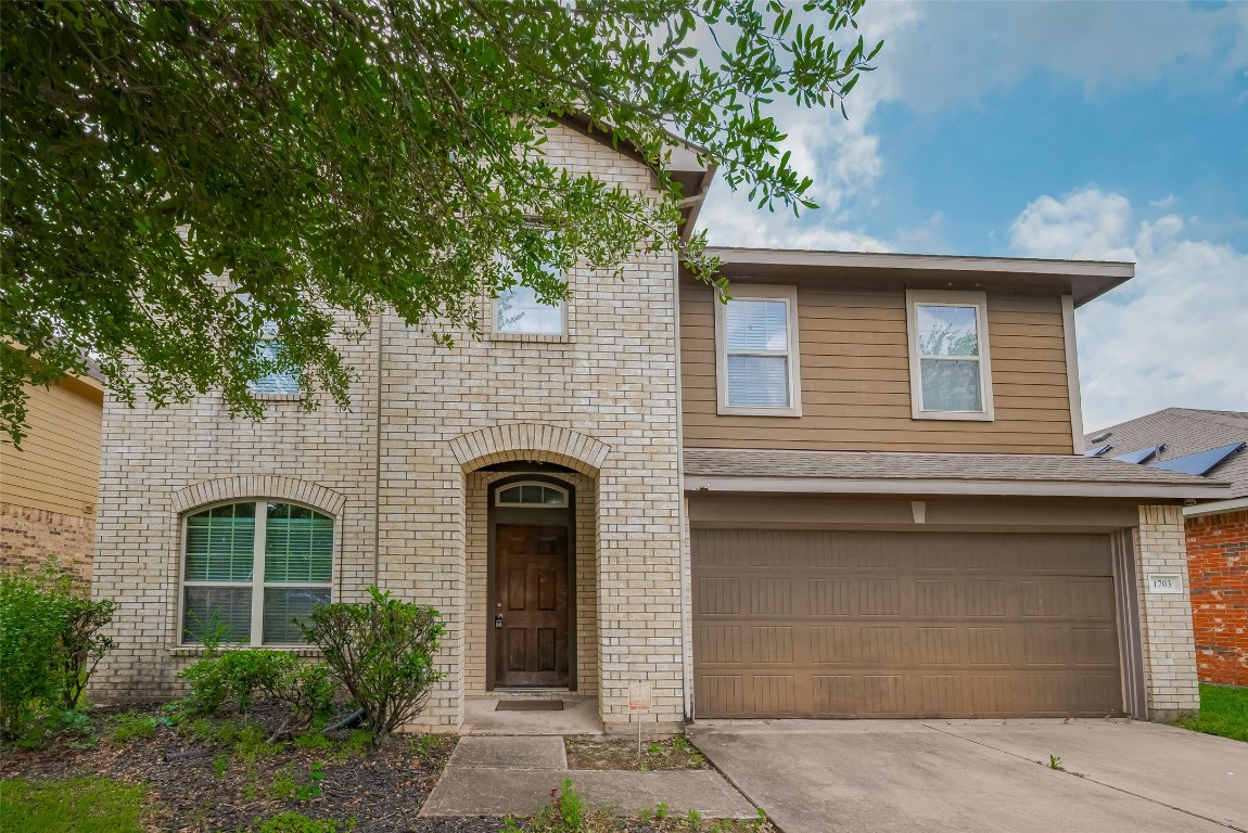 1703 Macclesby Lane Houston, TX 77049 - Photo 2 of 41 a front view of a house with yard