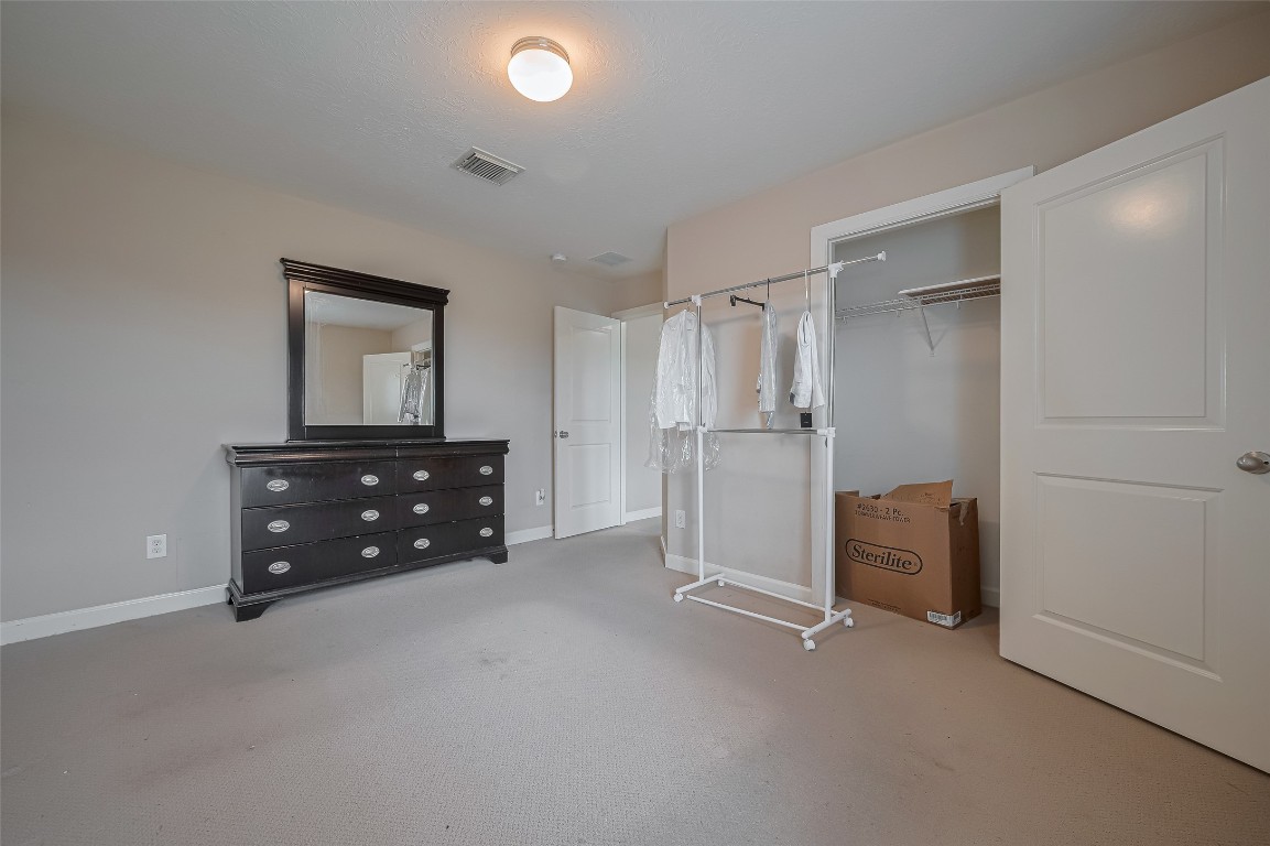 1703 Macclesby Lane Houston, TX 77049 - Photo 22 of 41 a room with furniture and a refrigerator
