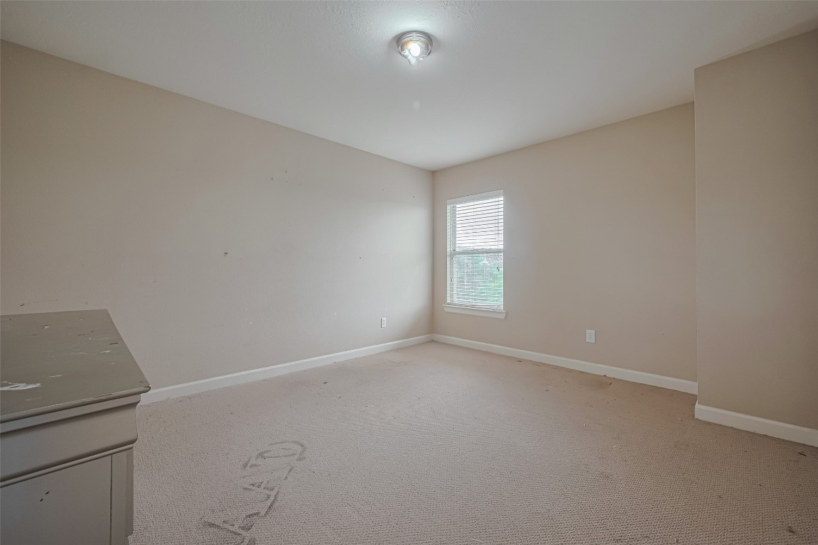 1703 Macclesby Lane Houston, TX 77049 - Photo 24 of 41 an empty room with windows