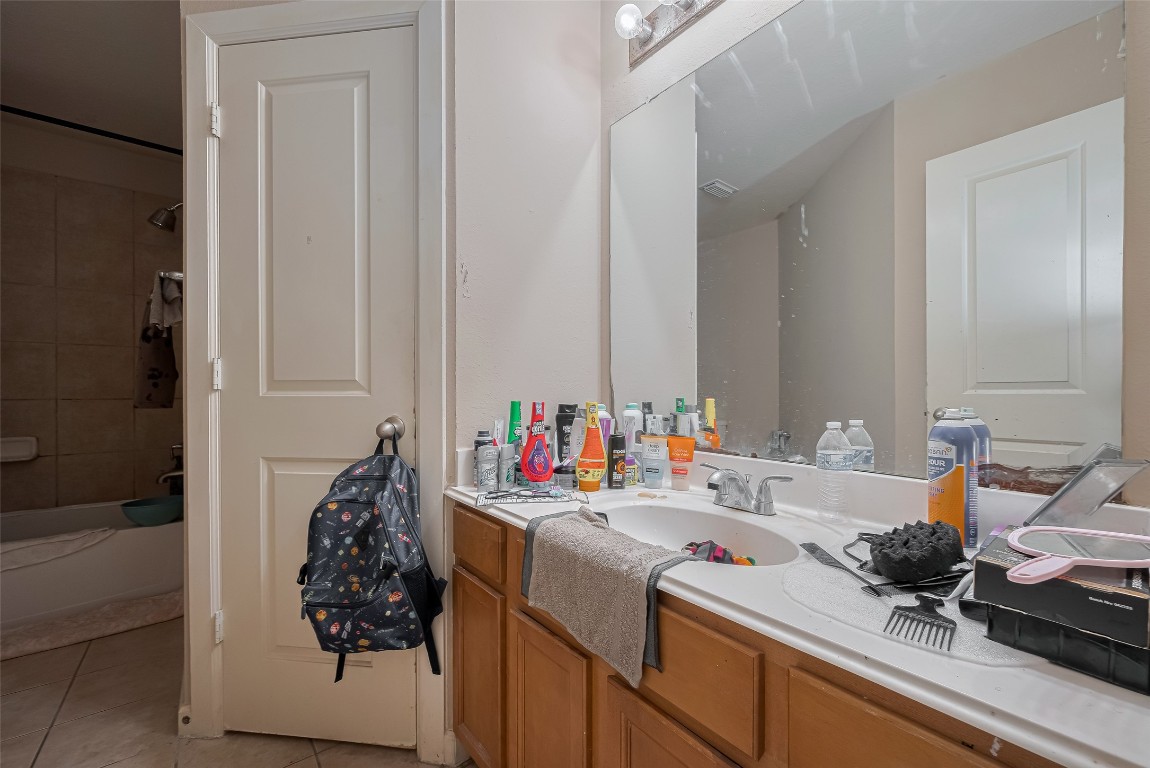 1703 Macclesby Lane Houston, TX 77049 - Photo 26 of 41 a bathroom with a sink and a mirror