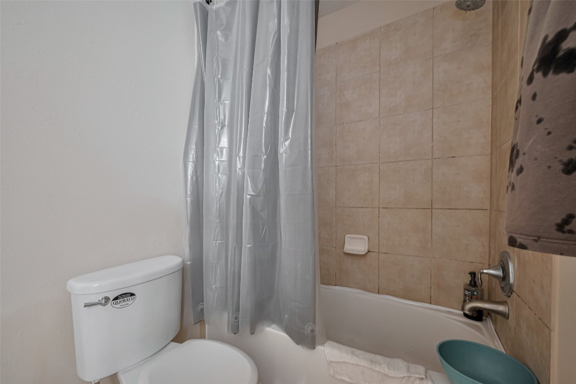 1703 Macclesby Lane Houston, TX 77049 - Photo 27 of 41 a bathroom with a sink a toilet and shower