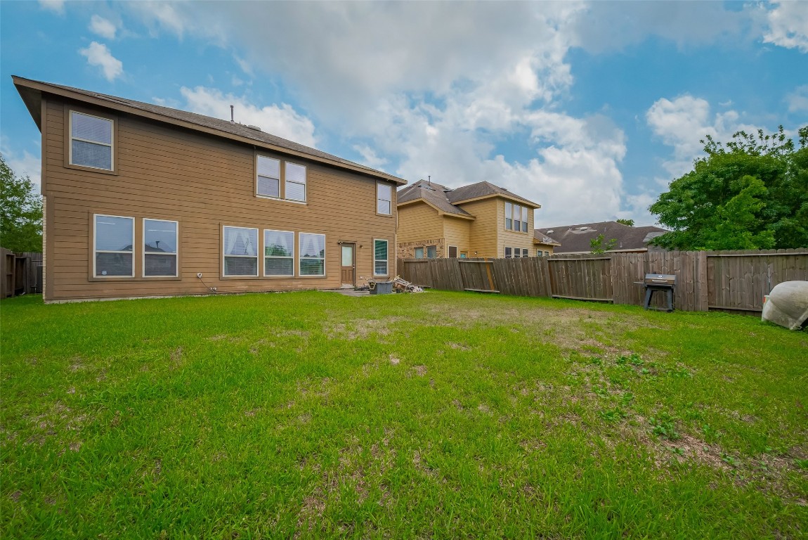 1703 Macclesby Lane Houston, TX 77049 - Photo 37 of 41 a house view with a garden space