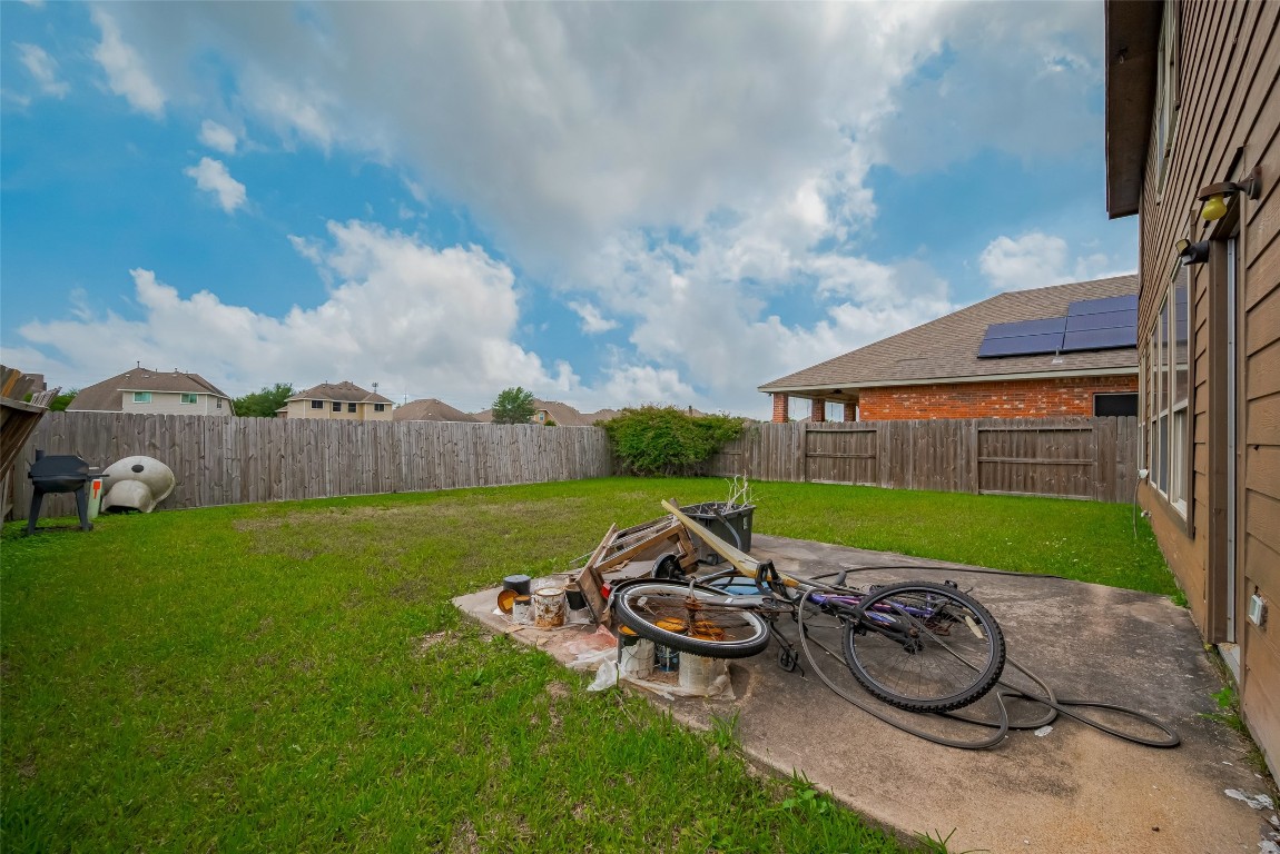 1703 Macclesby Lane Houston, TX 77049 - Photo 40 of 41 a table and chairs sitting in the backyard of house