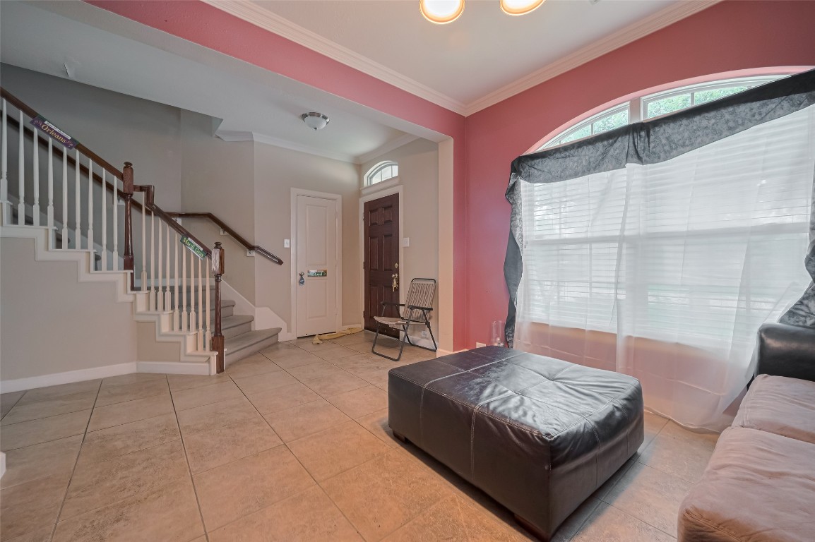 1703 Macclesby Lane Houston, TX 77049 - Photo 6 of 41 a living room with a couch and a table