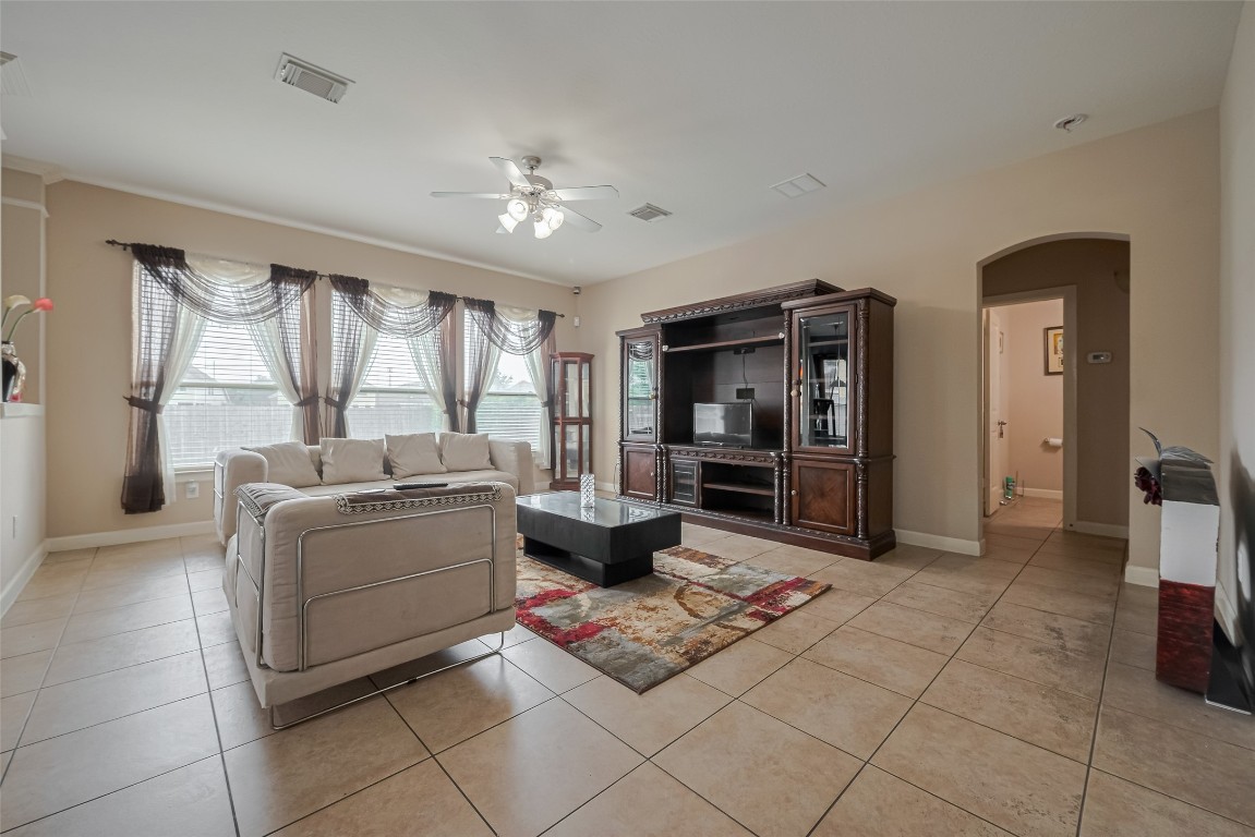 1703 Macclesby Lane Houston, TX 77049 - Photo 7 of 41 a living room with furniture and a large window