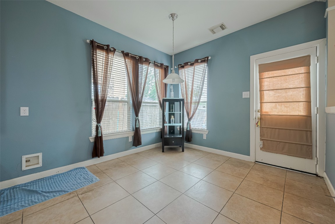1703 Macclesby Lane Houston, TX 77049 - Photo 10 of 41 a view of an empty room with a window