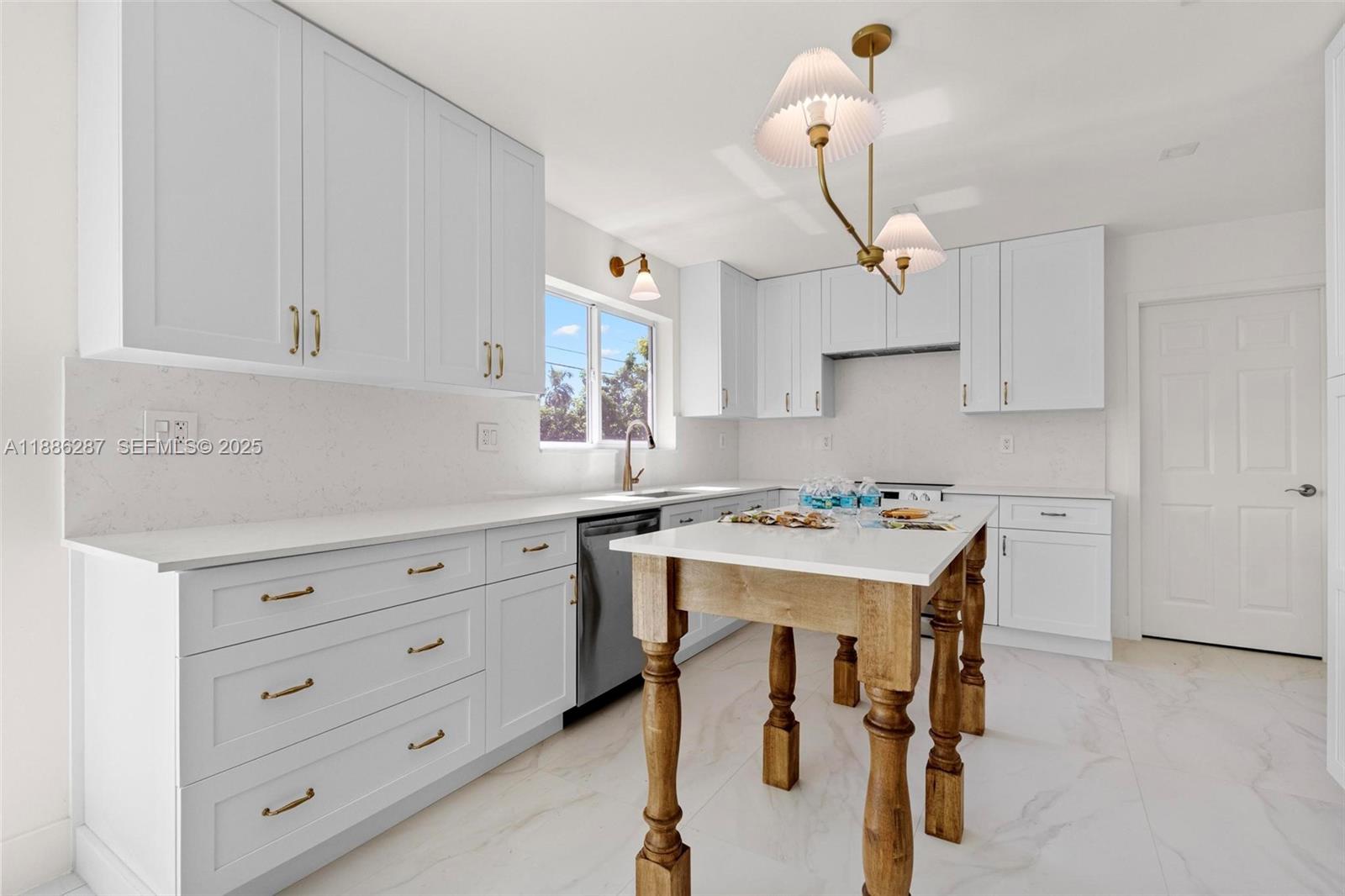 19221 Southwest 92nd Road Cutler Bay, FL 33157 - Photo 25 of 49 a kitchen with a stove a refrigerator and cabinets