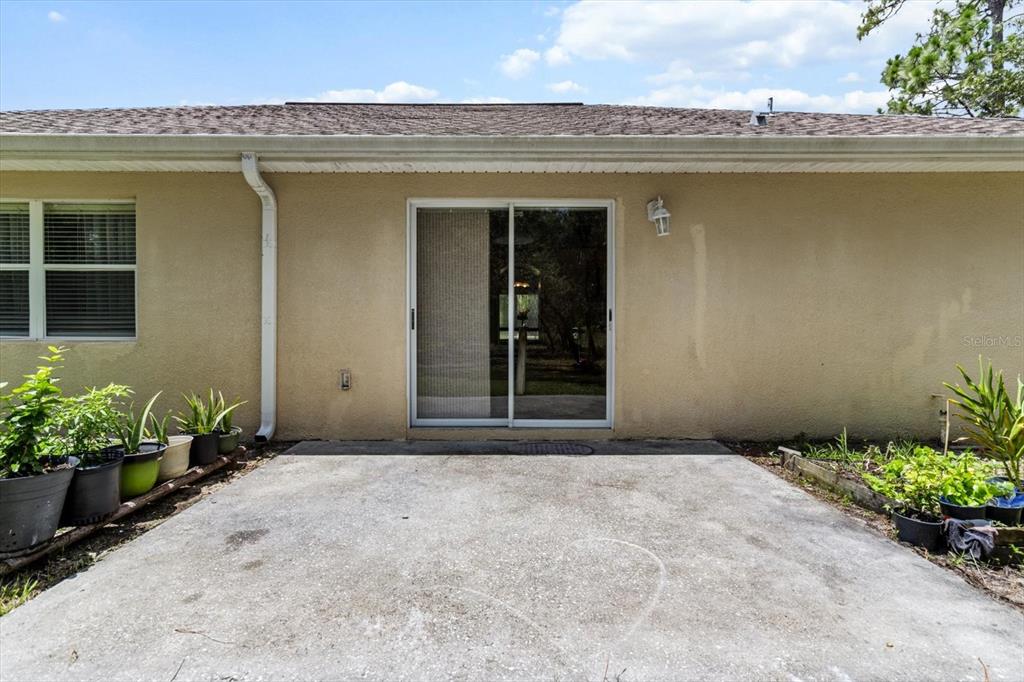 16038 Malden Road Weeki Wachee, FL 34614 - Photo 26 of 40 front view of a house with a garden