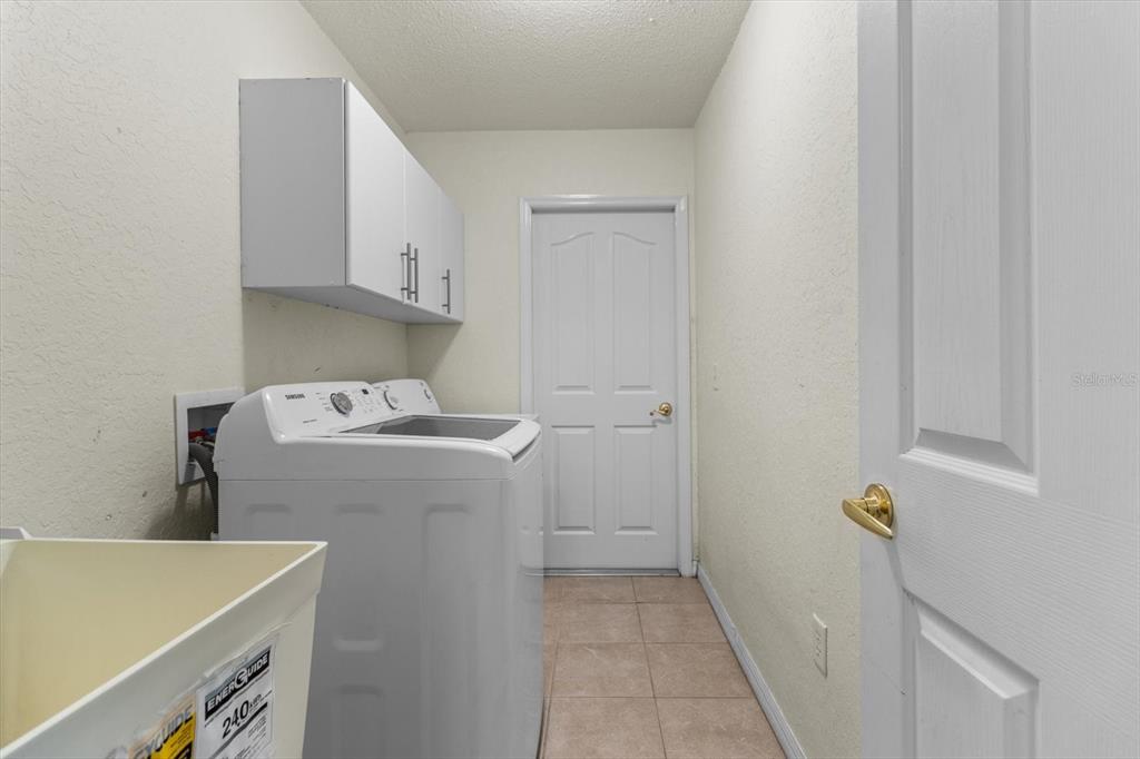 16038 Malden Road Weeki Wachee, FL 34614 - Photo 29 of 40 a utility room with dryer and washer