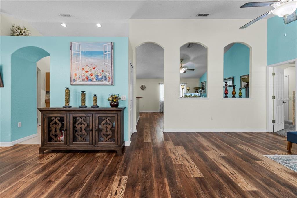 16038 Malden Road Weeki Wachee, FL 34614 - Photo 8 of 40 a view of a hallway with wooden floor