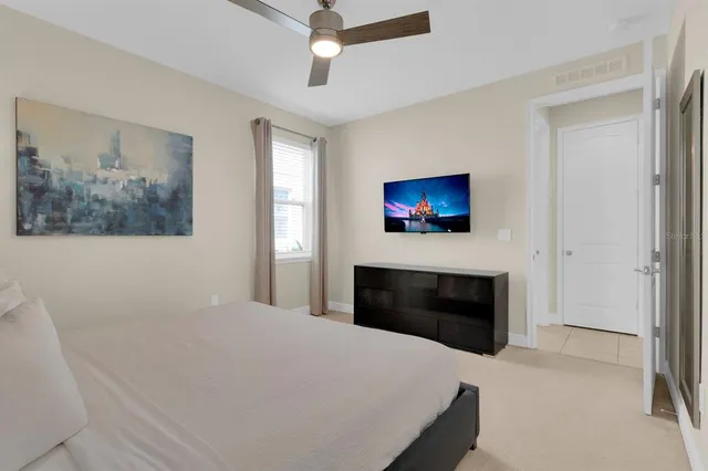 a bedroom with a bed and a fireplace