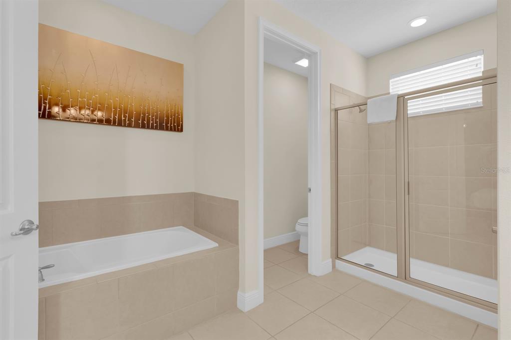 7403 Marker Avenue Kissimmee, FL 34747 - Photo 17 of 49 a white bath tub sitting next to a shower