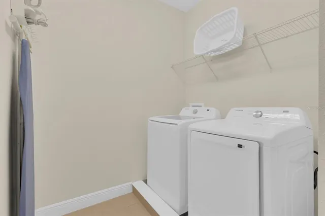 a utility room with dryer and washer