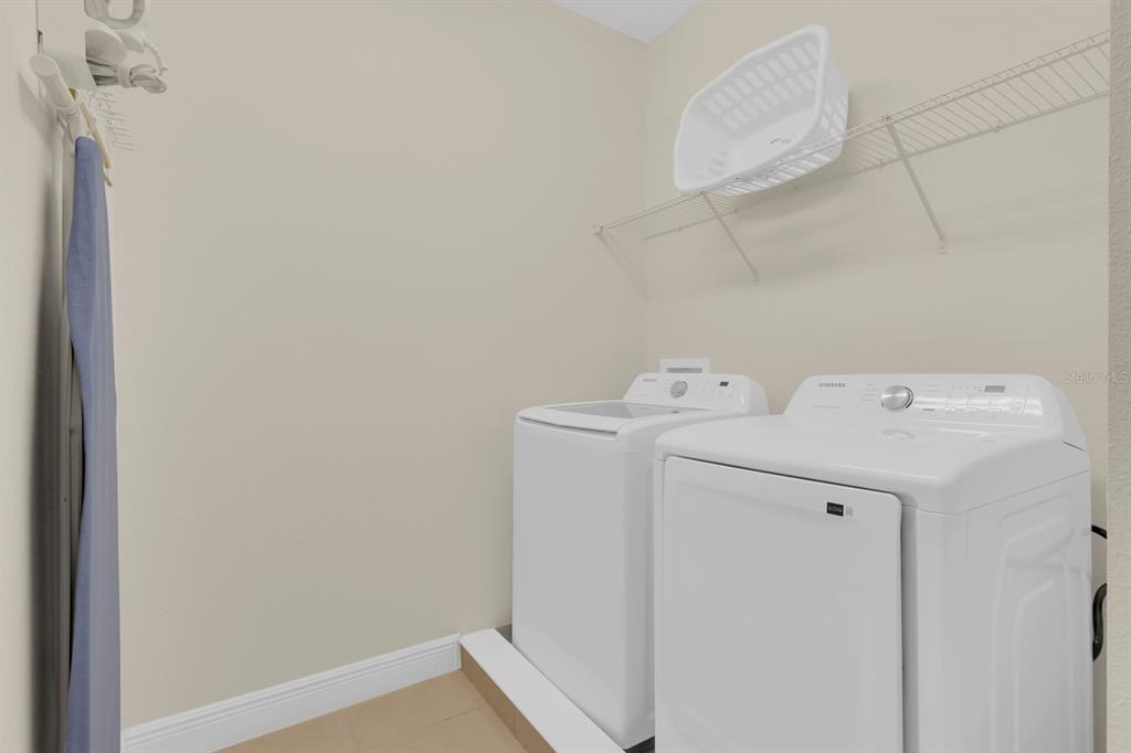 7403 Marker Avenue Kissimmee, FL 34747 - Photo 25 of 49 a utility room with dryer and washer
