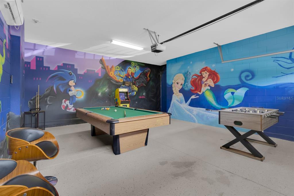 7403 Marker Avenue Kissimmee, FL 34747 - Photo 41 of 49 a living room with furniture and a wall painting