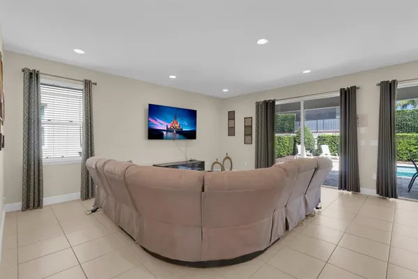 a living room with furniture and large window