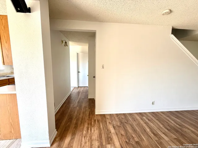 a kitchen with sink a counter and cabinets