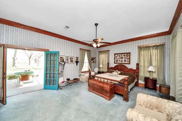 a bedroom with bed and window