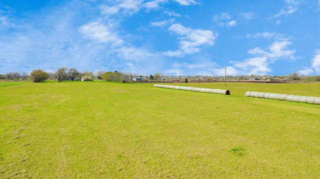 a view of house with outdoor space and swimming pool