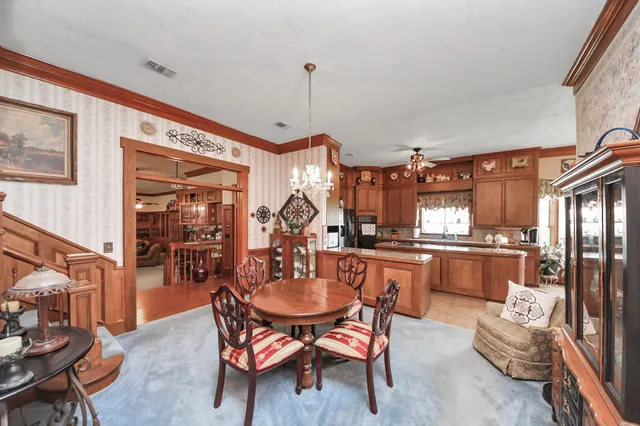 a dining room with furniture and window