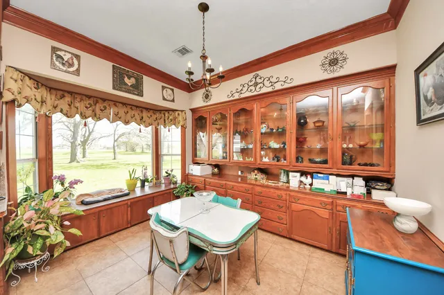 a very nice looking dining room with a large window