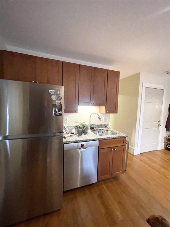 2 Hagar Street, Unit 2 Boston, MA 02130 - Photo 11 of 19 a kitchen with stainless steel appliances granite countertop a refrigerator a sink and a stove