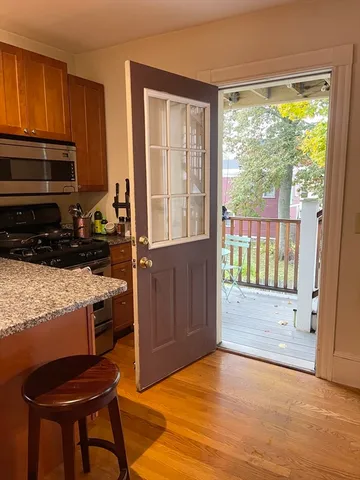 a view of kitchen with furniture and staircase