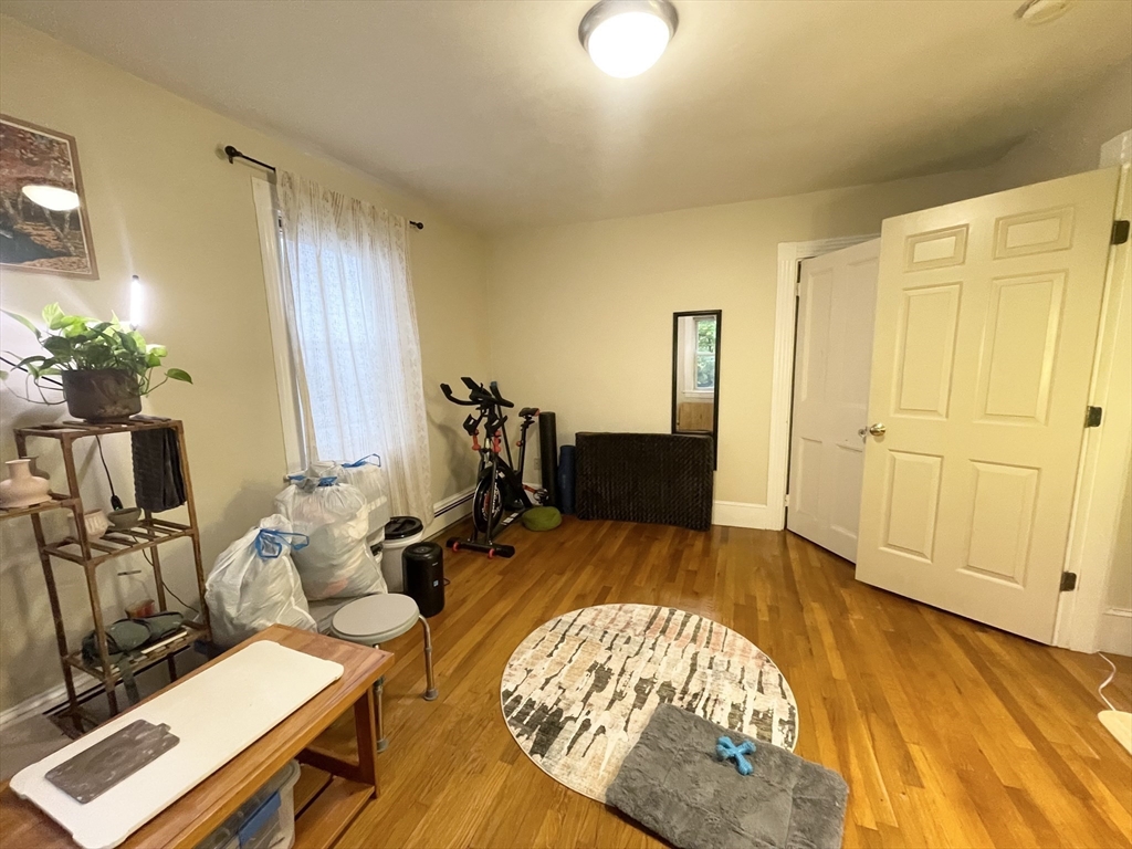 2 Hagar Street, Unit 2 Boston, MA 02130 - Photo 18 of 19 a bed room with a bed and a table