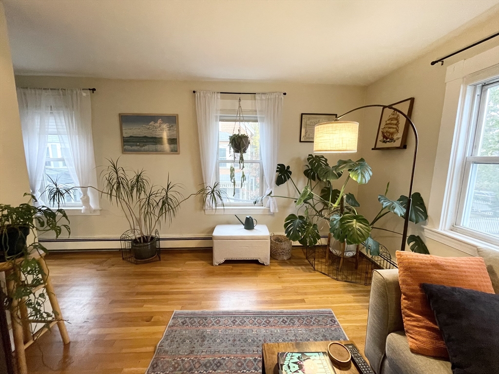 2 Hagar Street, Unit 2 Boston, MA 02130 - Photo 2 of 19 a living room with furniture and a wooden floor