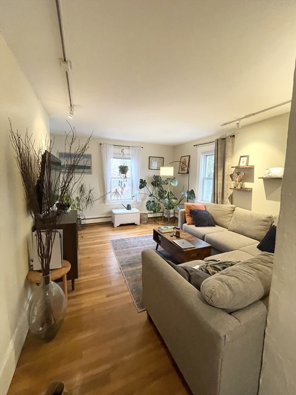 2 Hagar Street, Unit 2 Boston, MA 02130 - Photo 4 of 19 a living room with furniture and a wooden floor