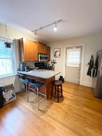 a workspace with furniture and a wooden floor