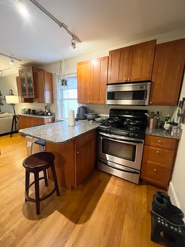 a kitchen with sink cabinets and appliances