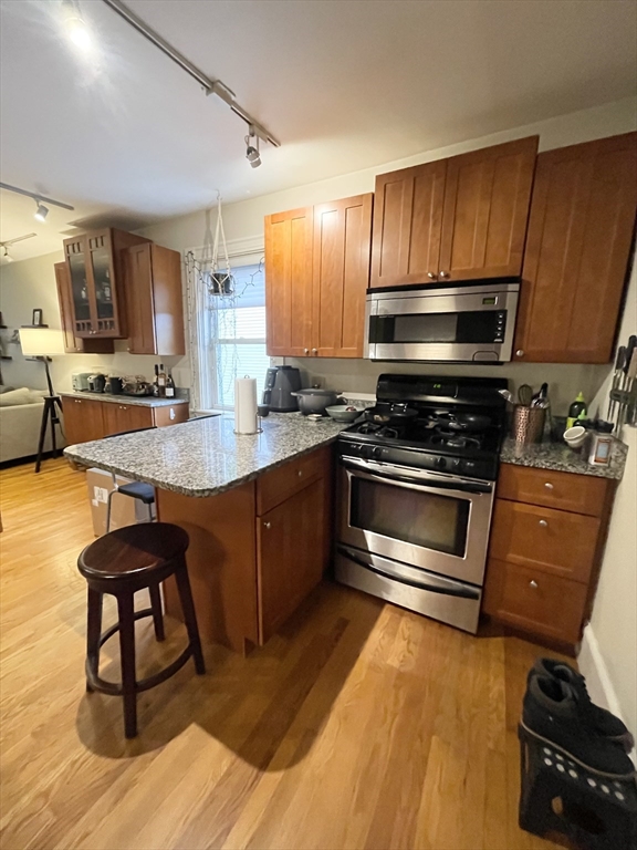 2 Hagar Street, Unit 2 Boston, MA 02130 - Photo 10 of 19 a kitchen with sink cabinets and appliances