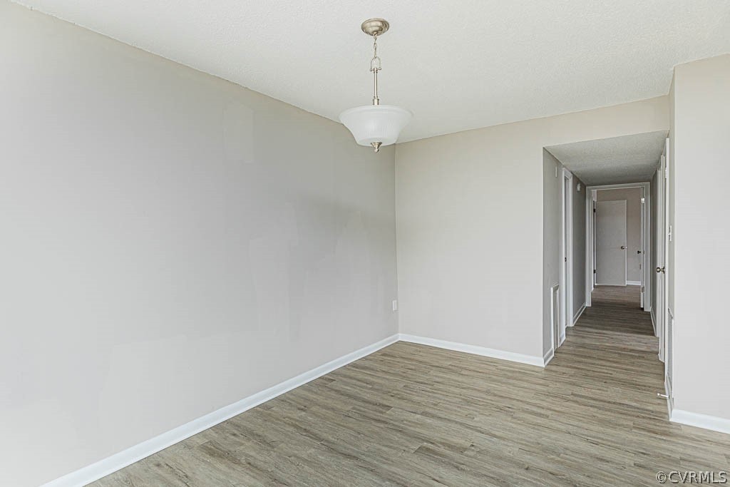 1511 Regency Woods Road, Unit 302 Henrico, VA 23238 - Photo 12 of 23 a view of a room with wooden floor and white walls