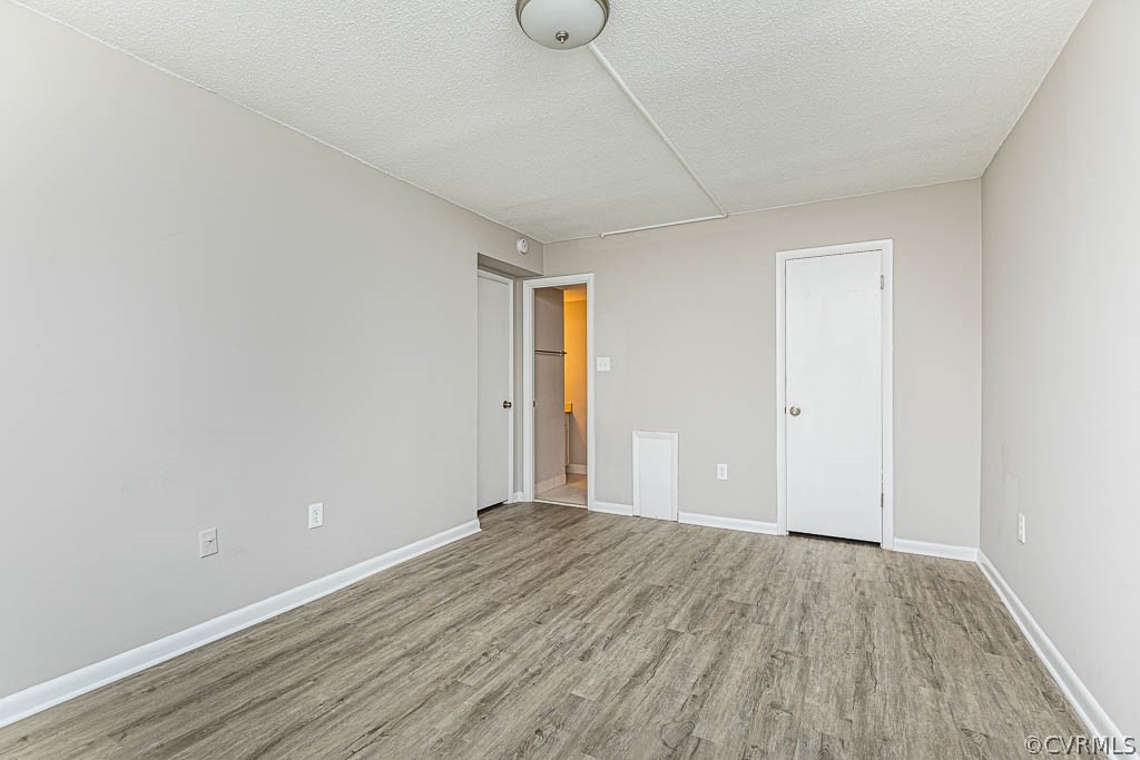 1511 Regency Woods Road, Unit 302 Henrico, VA 23238 - Photo 13 of 23 a view of an empty room with wooden floor