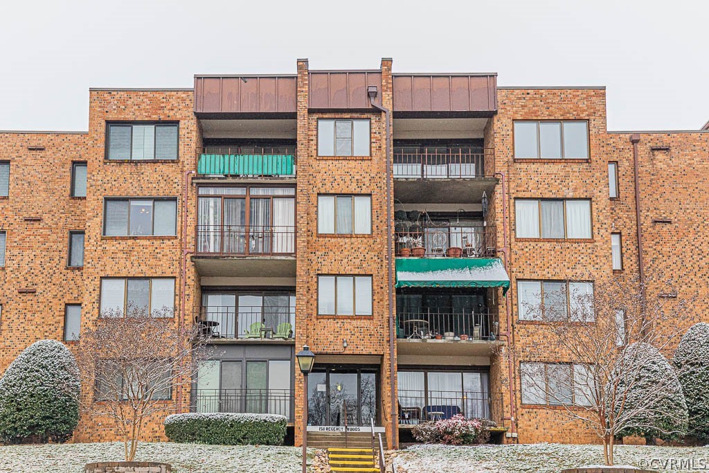 1511 Regency Woods Road, Unit 302 Henrico, VA 23238 - Photo 23 of 23 a front view of a residential apartment building with a yard