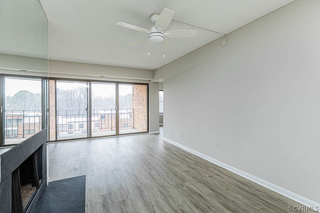 1511 Regency Woods Road, Unit 302 Henrico, VA 23238 - Photo 5 of 23 wooden floor in an empty room with a window