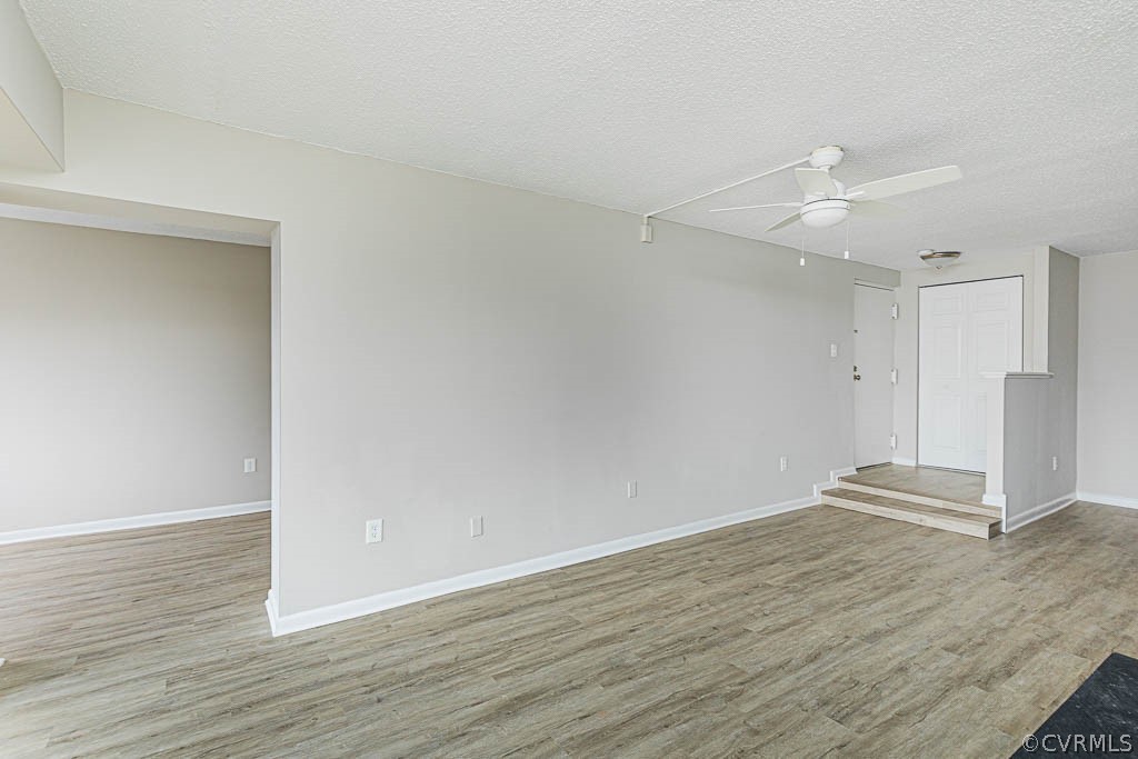 1511 Regency Woods Road, Unit 302 Henrico, VA 23238 - Photo 7 of 23 an empty room with wooden floor and ceiling fan