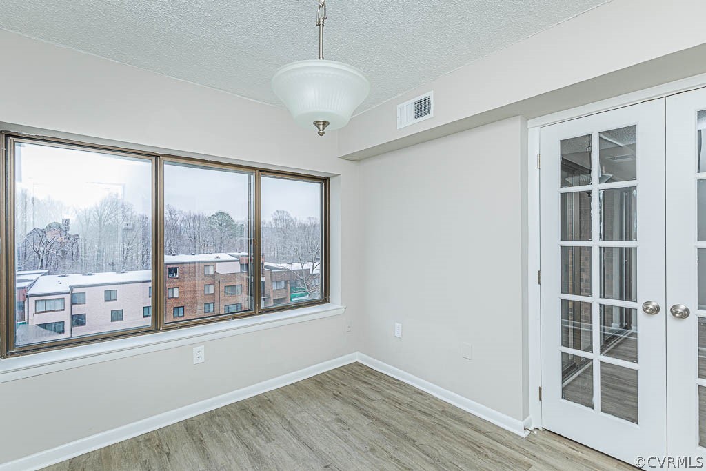 1511 Regency Woods Road, Unit 302 Henrico, VA 23238 - Photo 9 of 23 a view of empty room with wooden floor and fan