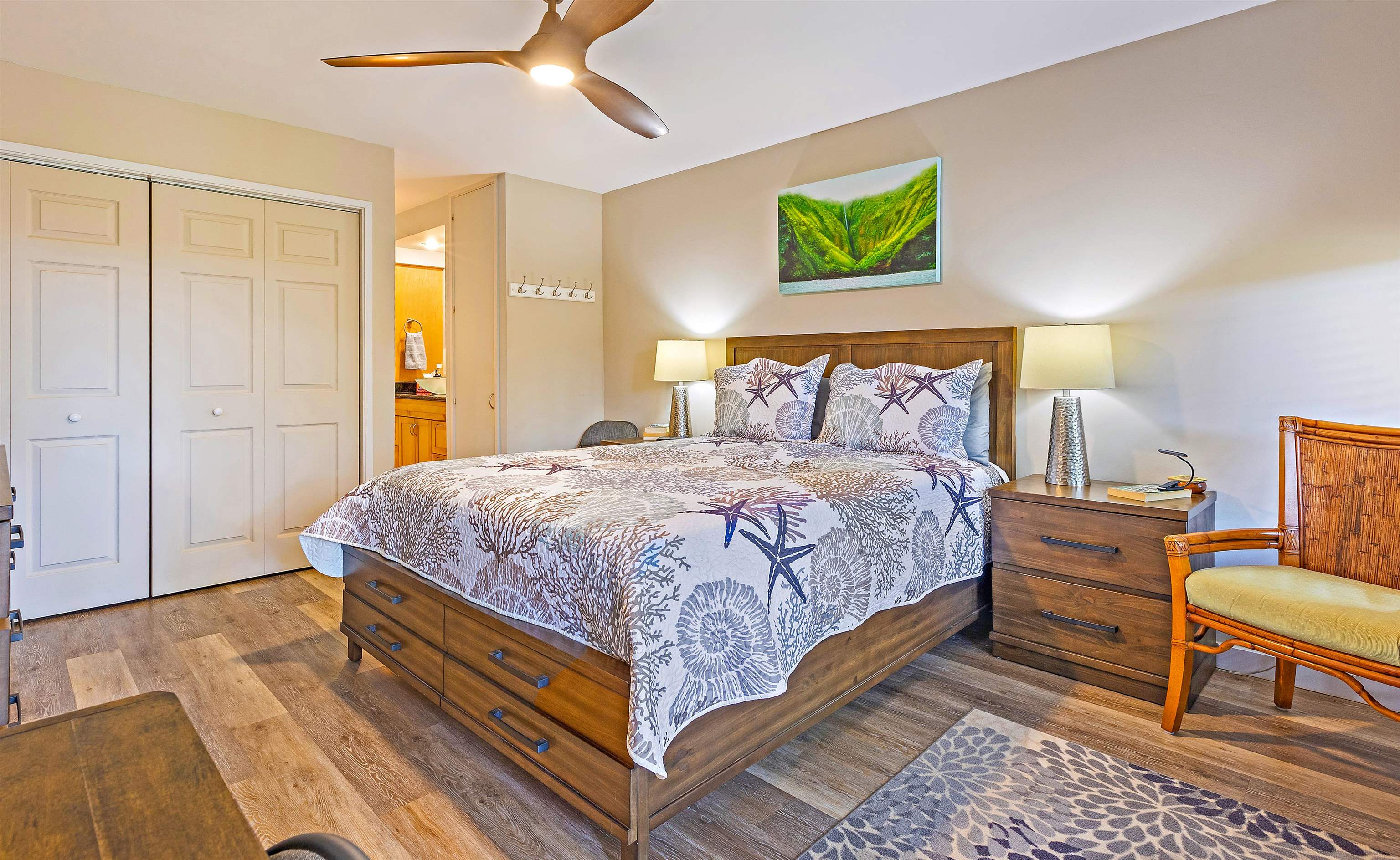 3788 Lower Honoapiilani Road, Unit A110 Lahaina, HI 96761 - Photo 12 of 35 a bedroom with a bed and a couch