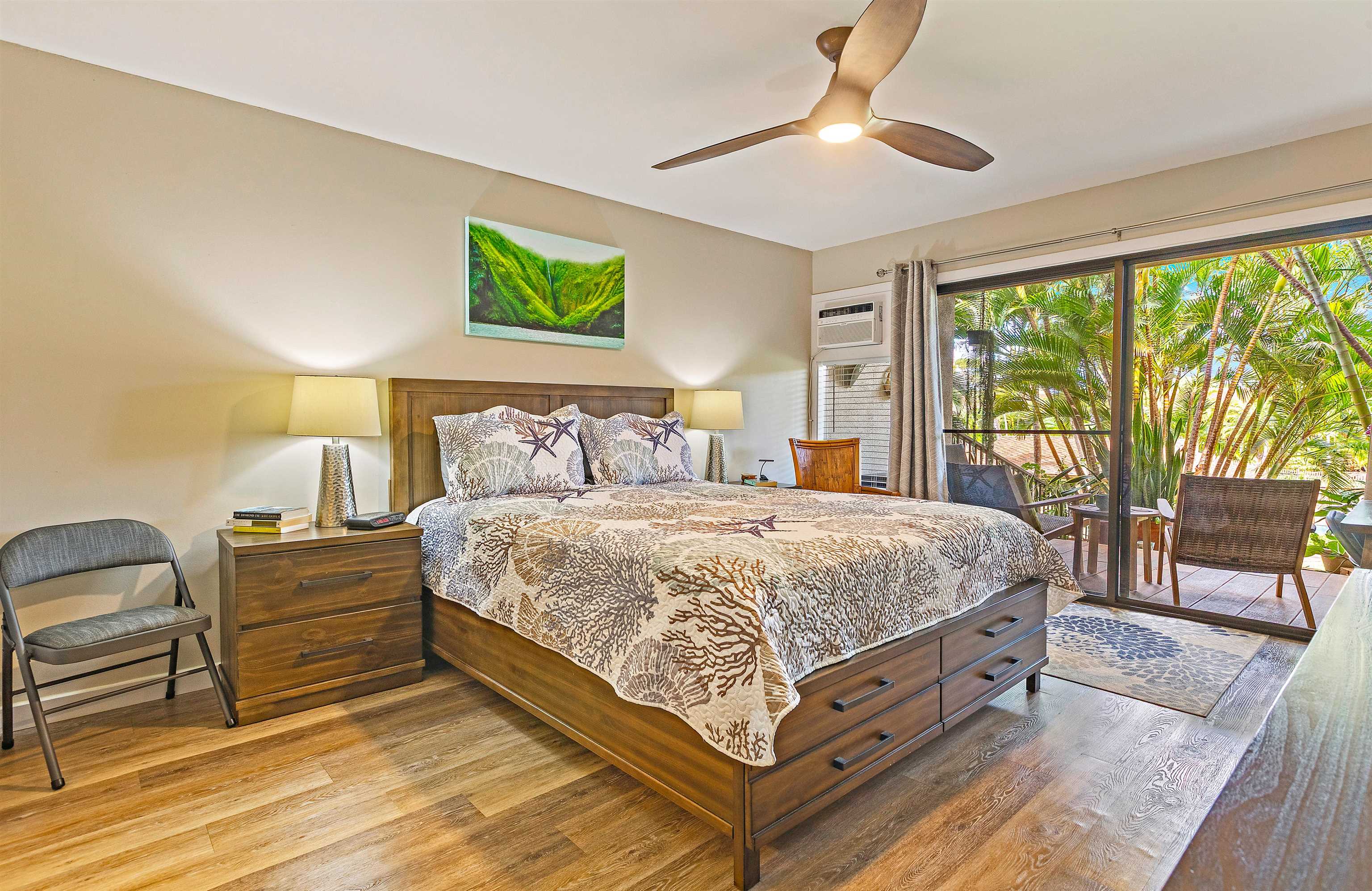 3788 Lower Honoapiilani Road, Unit A110 Lahaina, HI 96761 - Photo 13 of 35 a bed sitting in a bedroom next to a window