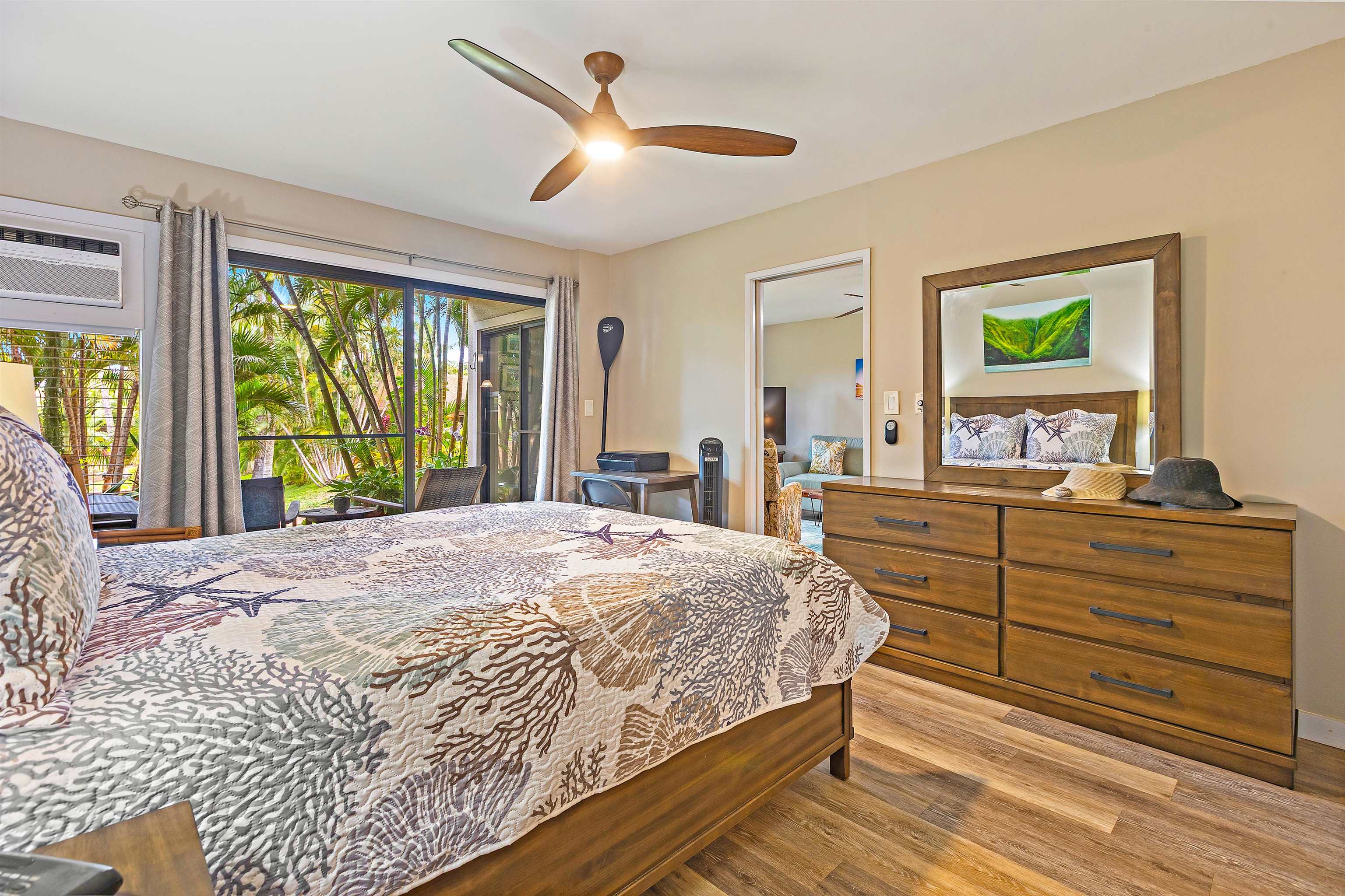 3788 Lower Honoapiilani Road, Unit A110 Lahaina, HI 96761 - Photo 14 of 35 a spacious bedroom with a large bed and a dresser