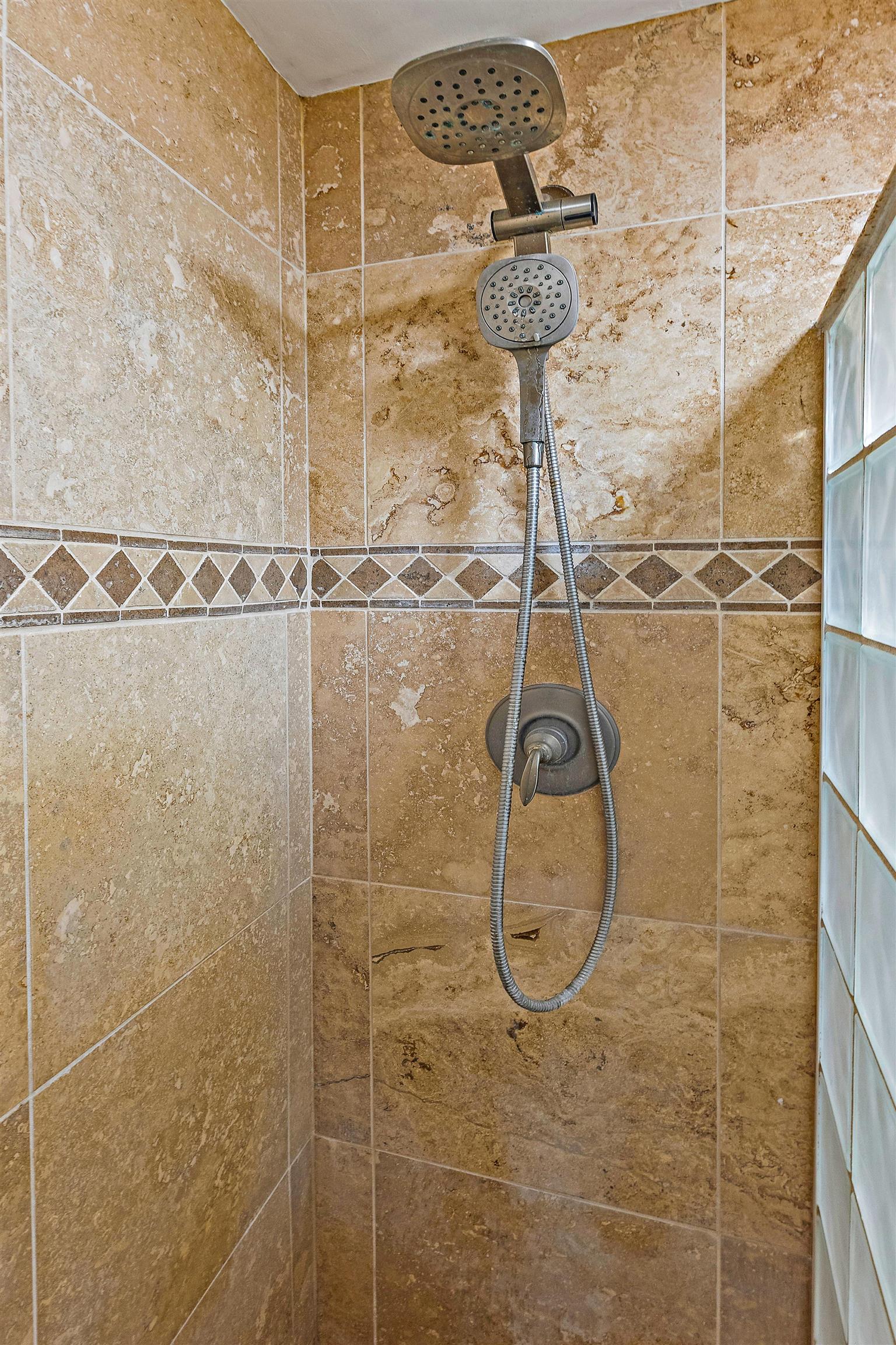 3788 Lower Honoapiilani Road, Unit A110 Lahaina, HI 96761 - Photo 24 of 35 a bathroom with a shower