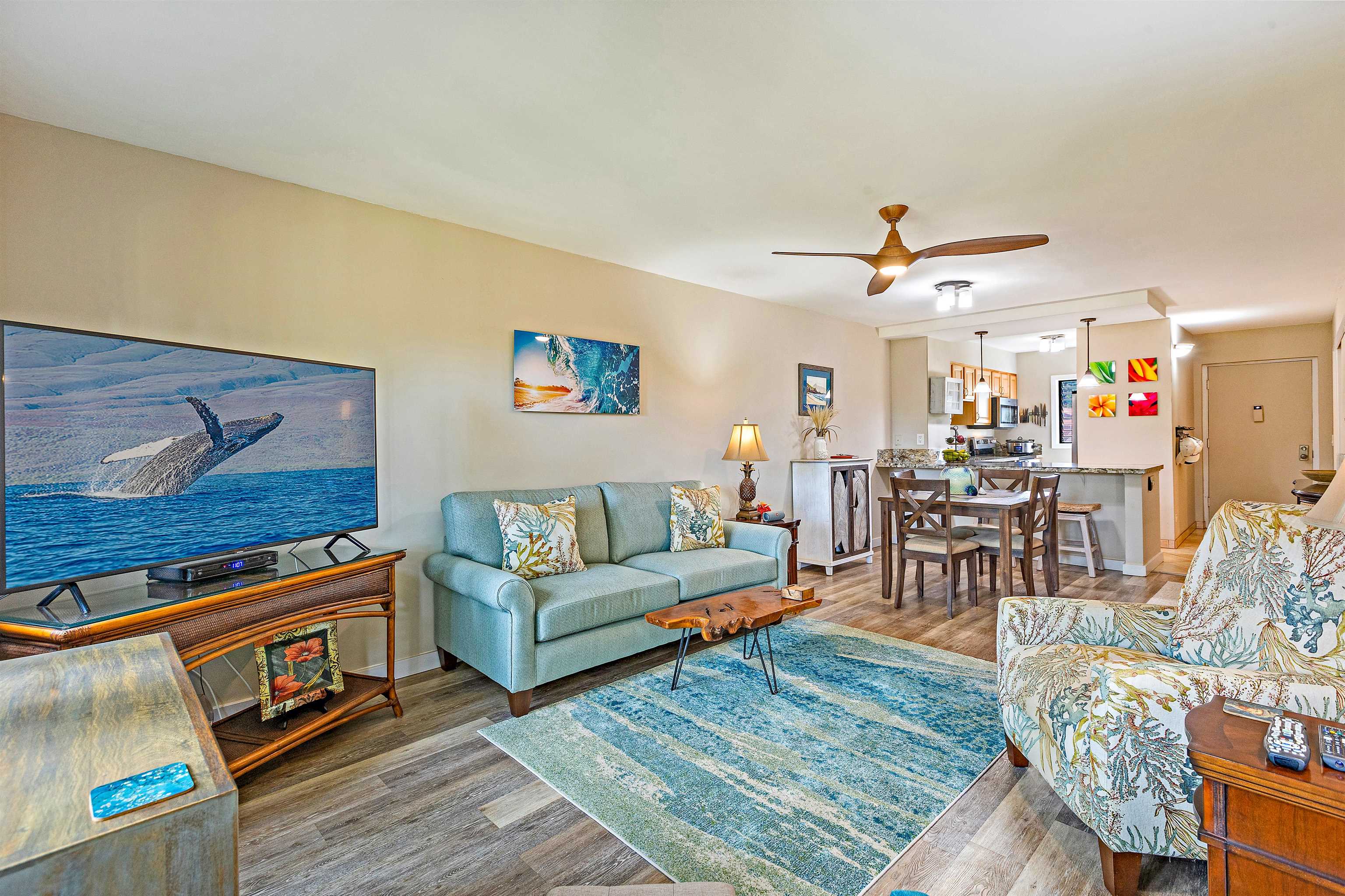 3788 Lower Honoapiilani Road, Unit A110 Lahaina, HI 96761 - Photo 3 of 35 a living room with furniture and wooden floor