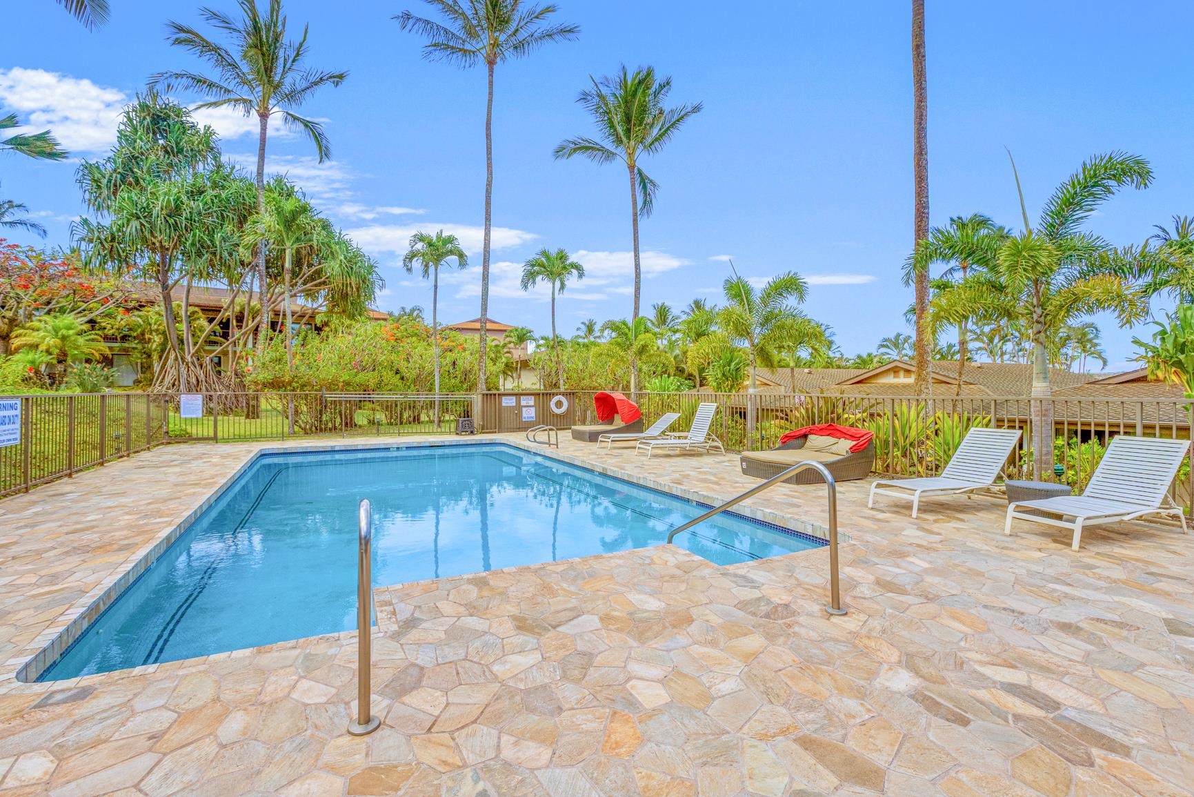 3788 Lower Honoapiilani Road, Unit A110 Lahaina, HI 96761 - Photo 32 of 35 a swimming pool with chairs