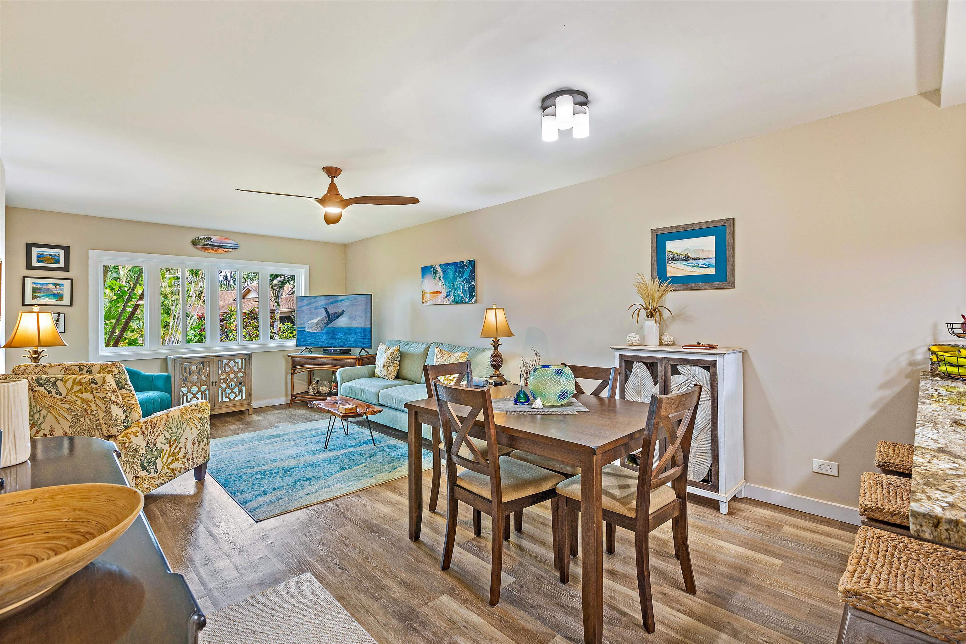 3788 Lower Honoapiilani Road, Unit A110 Lahaina, HI 96761 - Photo 7 of 35 a view of a dining room with furniture window and wooden floor
