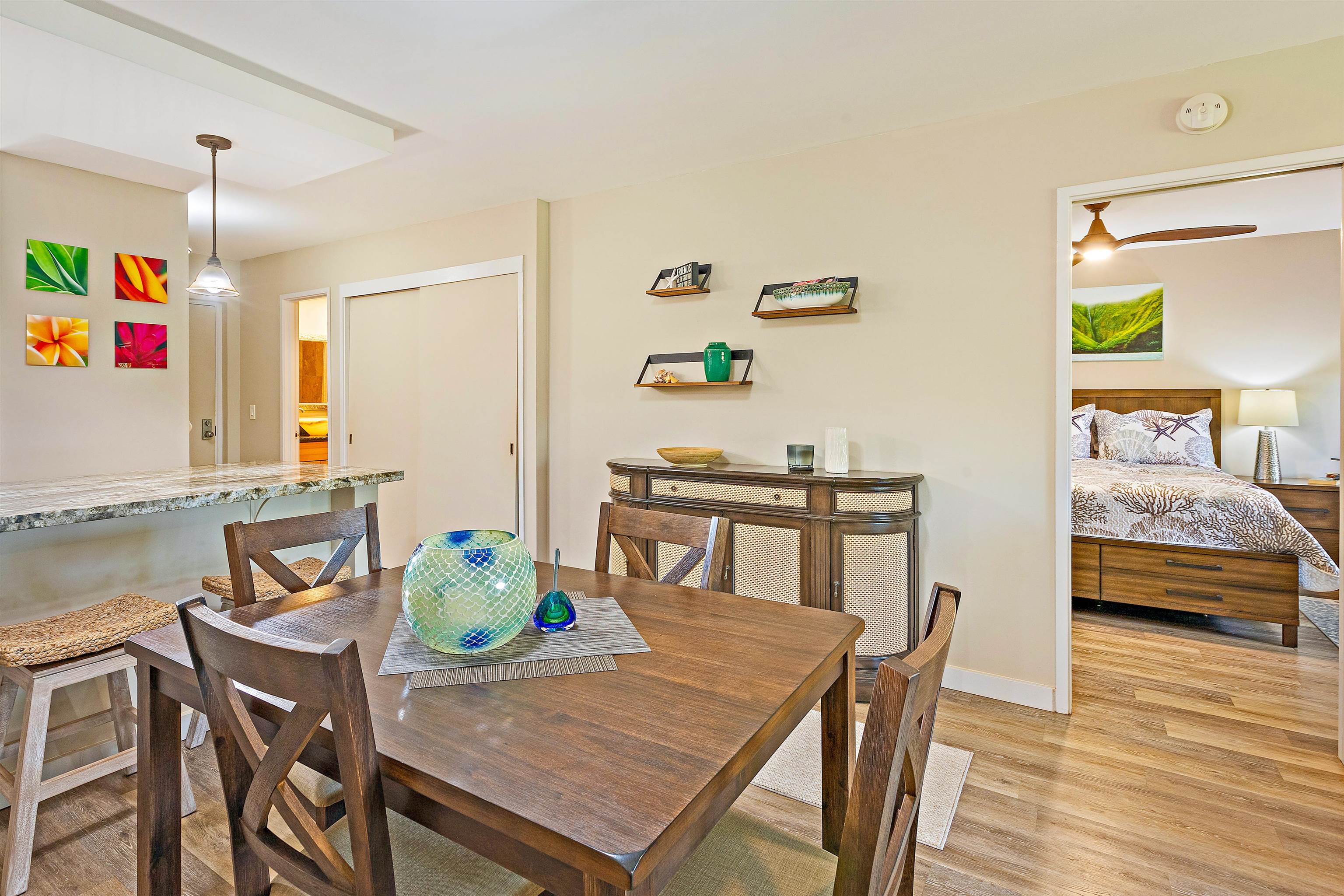 3788 Lower Honoapiilani Road, Unit A110 Lahaina, HI 96761 - Photo 8 of 35 a view of a dining room with furniture and wooden floor